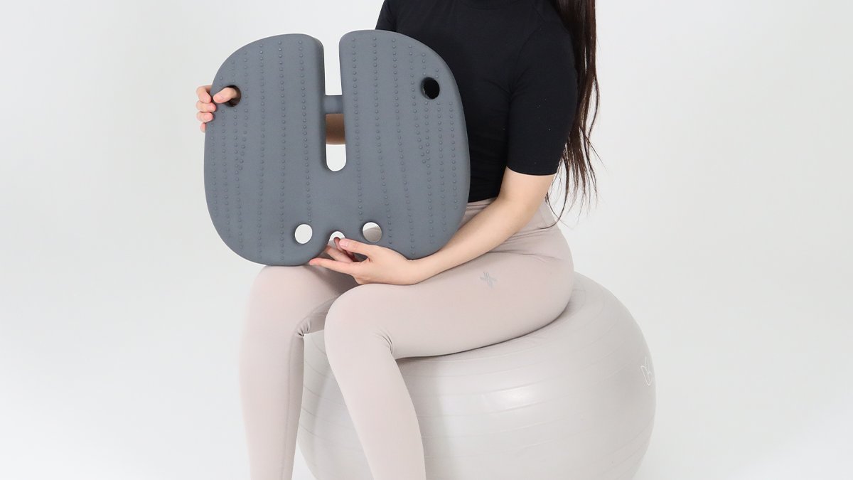 Gym ball benefits in a seat cushion! Posture corrector made by a patient diagnosed with a herniated disc