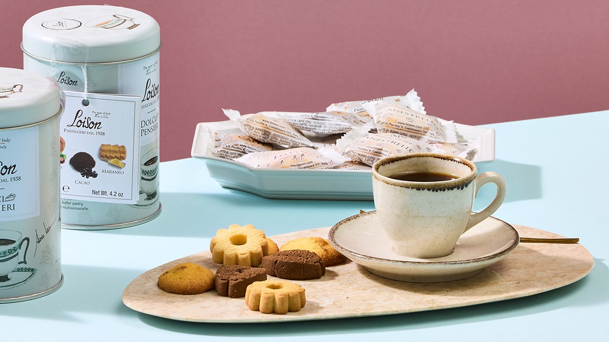 Why do European gourmets savor these biscuits with their coffee?